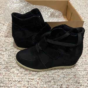 Womens’s size 6 black wedge sneakers. New in box, never worn